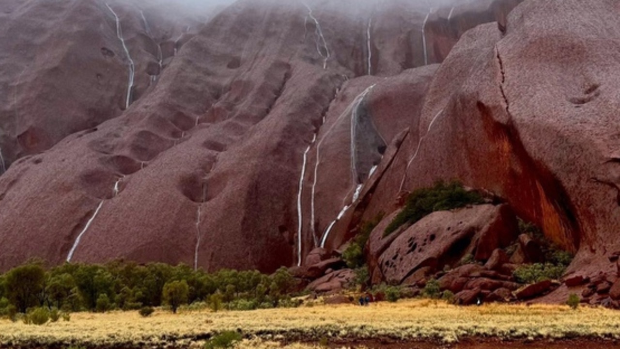 Stunning Uluru sight as rain smashes country