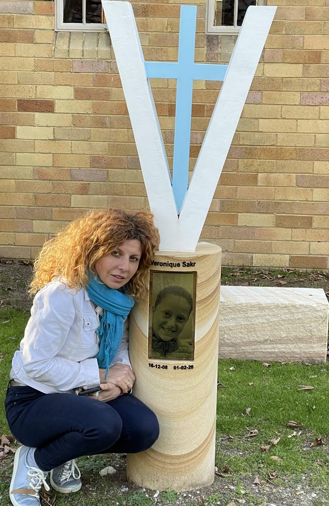 Bridget Sakr with a memorial to her daughter Veronique Sakr, who was tragically killed in the Oatlands crash along with three of her cousins.