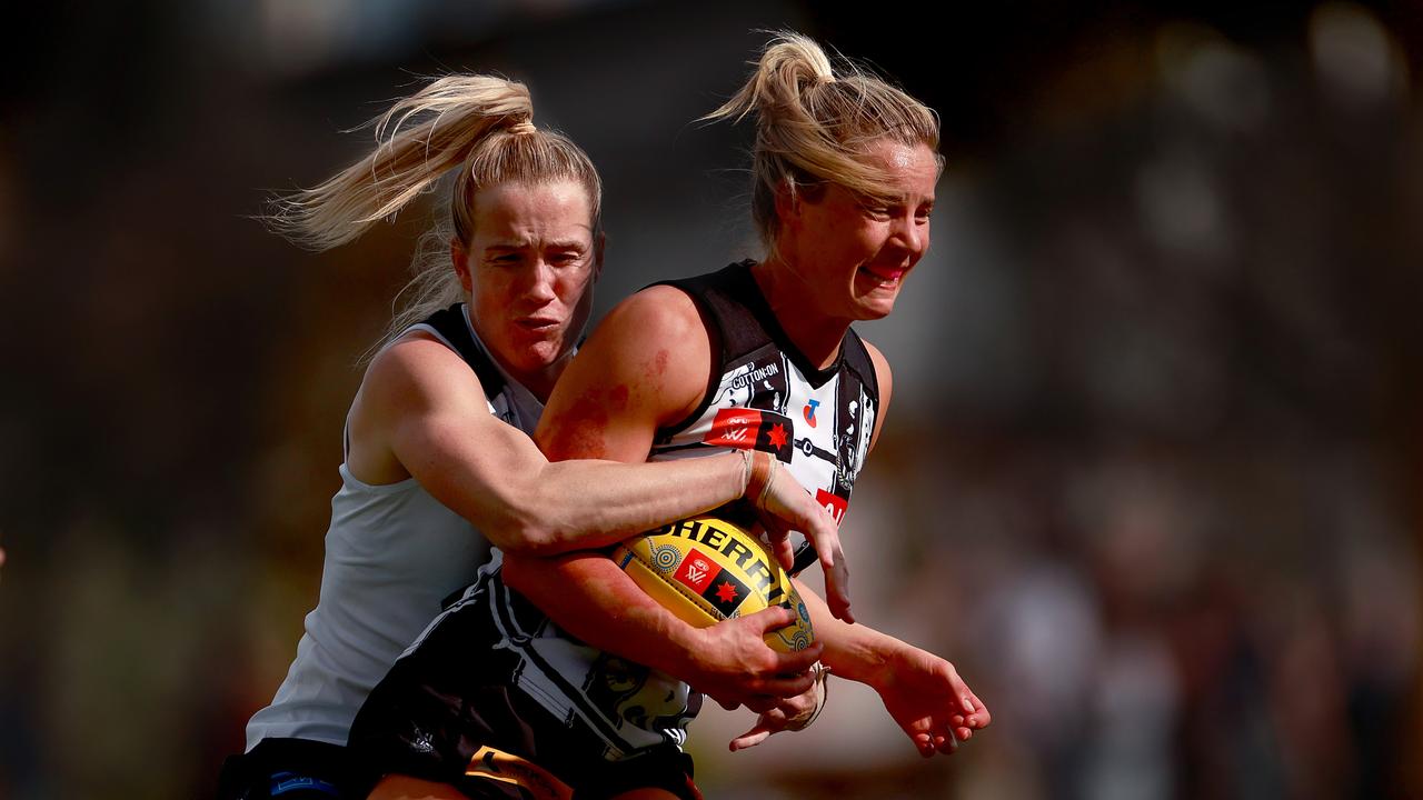 Jordan Ivey of the Magpies is tackled by Celine Moody of the Blues. Picture: Kelly Defina/AFL Photos/via Getty Images