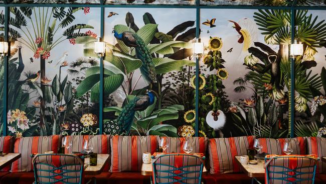 The vibrant garden-inspired wallpaper in The Conservatory.