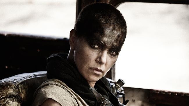 This photo provided by Warner Bros. Pictures shows Charlize Theron as Imperator Furiosa in Warner Bros. Pictures’ and Village Roadshow Pictures’ action adventure film, “Mad Max: Fury Road," a Warner Bros. Pictures release. (Jasin Boland/Warner Bros. Pictures via AP)