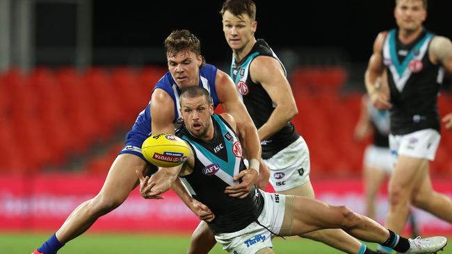 Travis Boak hunts the footy with Cam Zurhaar hot on his tail. Picture: Michael Klein