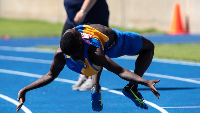 Rashid Kabba from Holroyd Club celebrating after winning the U17 110m hurdles.