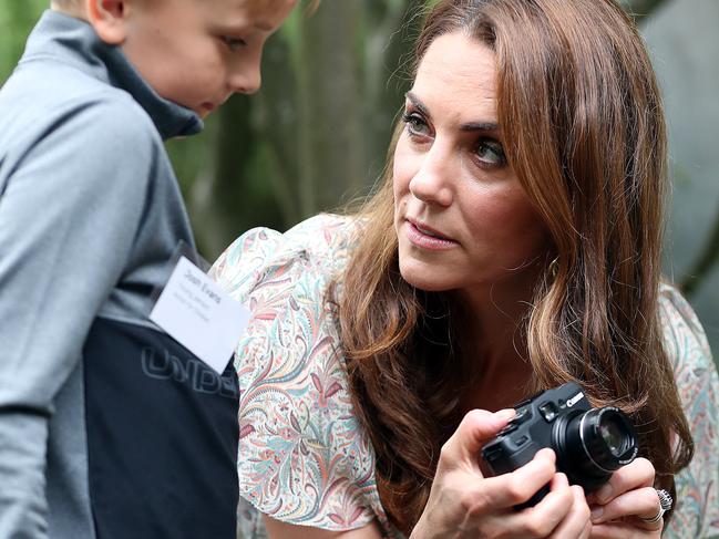 KINGSTON, ENGLAND - JUNE 25: Catherine, Duchess of Cambridge speaks with Josh Evans at photography workshop for Action for Children, run by the Royal Photographic Society at Warren Park on June 25, 2019 in Kingston, England. (Photo by Chris Jackson/Getty Images)