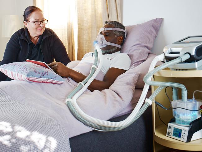 A file picture of a person using a CPAP device. Doctors think using more of these devices could ease pressure on ventilators in intensive care units.