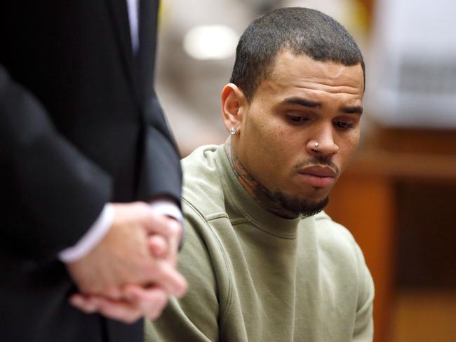 Chris Brown continues to divide fans and the industry because of his domestic violence charge. Picture: Lucy Nicholson - Pool/Getty Images.