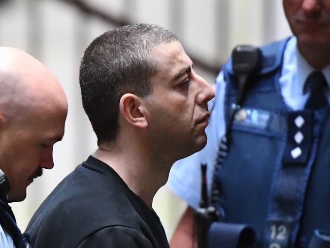 Ali Chaouk (centre) arrives at the Supreme Court of Victoria in Melbourne, Wednesday, November 21, 2018. Mr Chaouk is accused of murdering Mohammed Haddara in Altona North on June 20, 2009. (AAP Image/James Ross) NO ARCHIVING