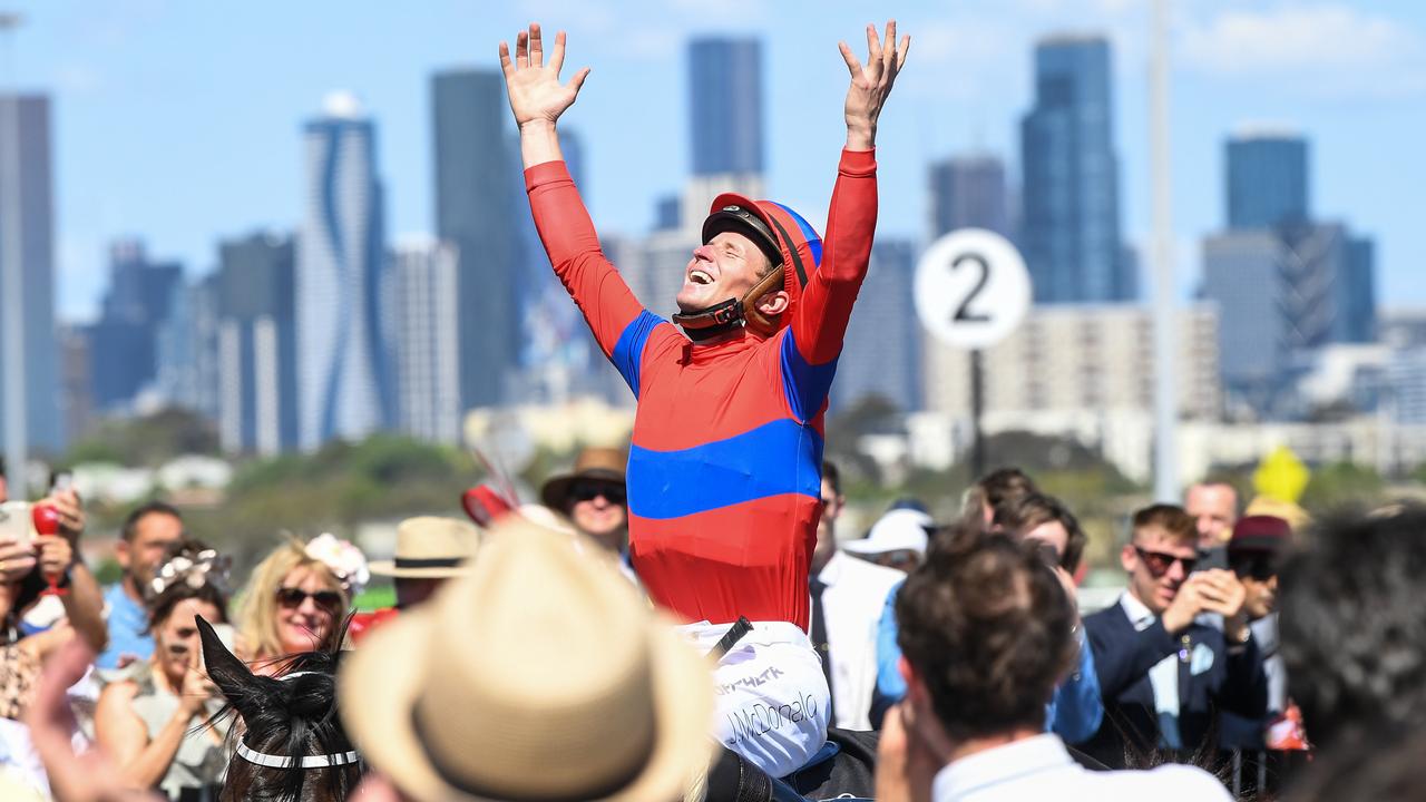 James McDonald celebrates the win. Reg Ryan/Racing Photos via Getty Images)