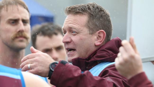 Modewarre coach Chris Carlon instructs his charges against Anglesea. Picture: Alan Barber