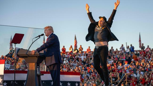 Tesla and SpaceX CEO Elon Musk jumps on stage as he joins Donald Trump during a campaign rally. Picture: Jim Watson / AFP
