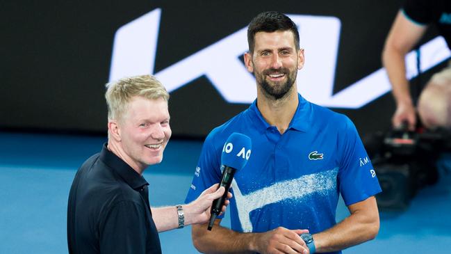 MELBOURNE, AUSTRALIA - JANUARY 21: Novak Djokovic (R) of Serbia gives an on-court interview after victory against Carlos Alcaraz of Spain in the Men's Singles Quarterfinal match during day 10 of the 2025 Australian Open at Melbourne Park on January 21, 2025 in Melbourne, Australia. (Photo by Andy Cheung/Getty Images)