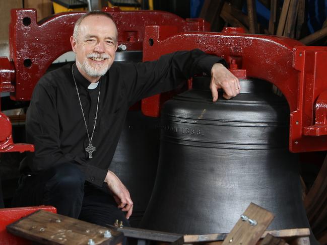 Reverend Sam Goodes at St Andrew's Church Walkerville, South Australia with the newly refurbished peel of church bells ready to be reinstalled in the churchsÃ bell tower. Photographer Emma Brasier.