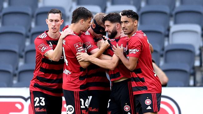 SYDNEY, AUSTRALIA - DECEMBER 22: Zachary Sapsford of the Wanderers celebrates scoring a goal with team mates during the round nine A-League Men match between Western Sydney Wanderers and Wellington Phoenix at CommBank Stadium, on December 22, 2024, in Sydney, Australia. (Photo by Brendon Thorne/Getty Images)