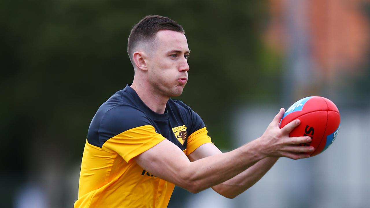 Tom Scully marks a ball during a training session at Xavier College on Monday.