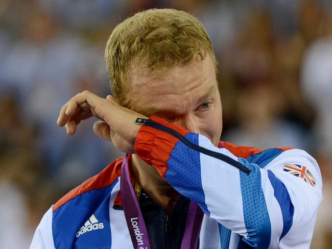 07/08/2012 WIRE: Great Britain's Sir Chris Hoy becomes emotional as he celebrates winning Gold in the Men's Keirin Final on day Eleven of the Olympic Games at the Velodrome in London.. Picture date: Tuesday August 7, 2012. See PA story OLYMPICS Cycling Track. Photo credit should read: John Giles/PA Wire. EDITORIAL USE ONLY OLY12 Pic. Pa