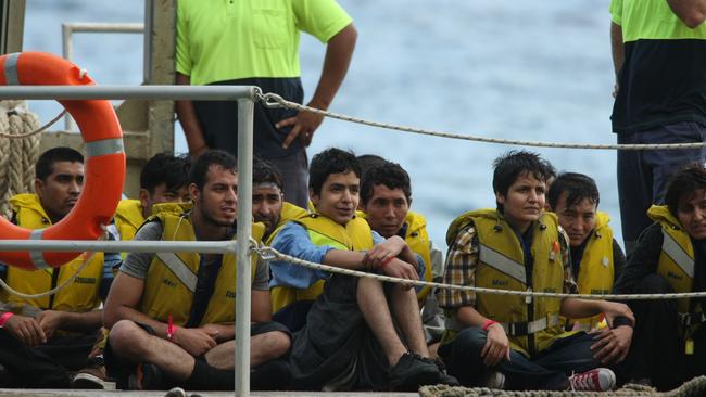 Asylum seekers on the deck of an Australian warship off Christmas Island