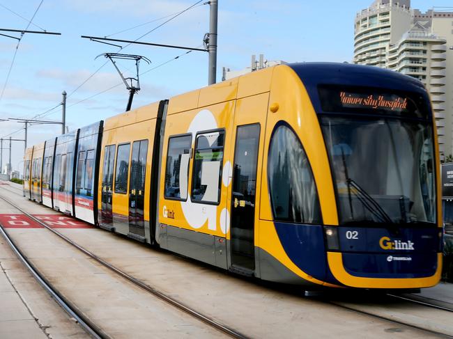 Gold Coast tram on the Southport Bridge . (sorry cloudy morning no sun ) . Picture Mike Batterham