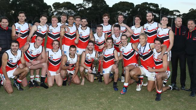 The Eastern Football League celebrates last year’s win. Picture: Stuart Milligan