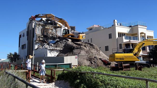 A 2012 photo of 47 Hedges Ave being demolished. The house has been owned by some the following identities: Michael Edgley, Ken Lacey, Terry Page, John Wade and Rod Gault. Pic by Luke Marsden.