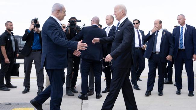 Israel Prime Minister Benjamin Netanyahu (L) greets US President Joe Biden upon his arrival at Tel Aviv's Ben Gurion airport on October 18.