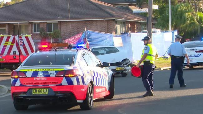 Police and ambulance crews descend on the Merrylands intersection.