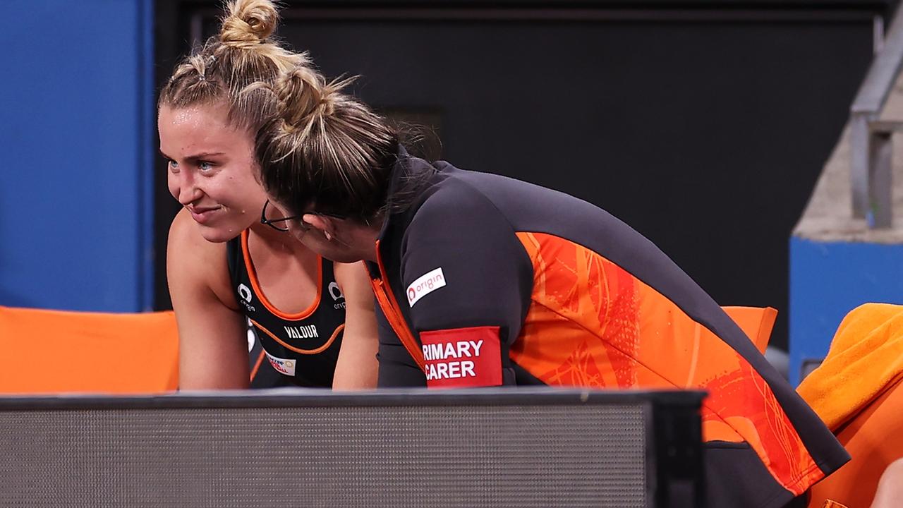 Jamie-Lee Price of the Giants speaks with the trainer after the leaving the court. Photo: Getty Images