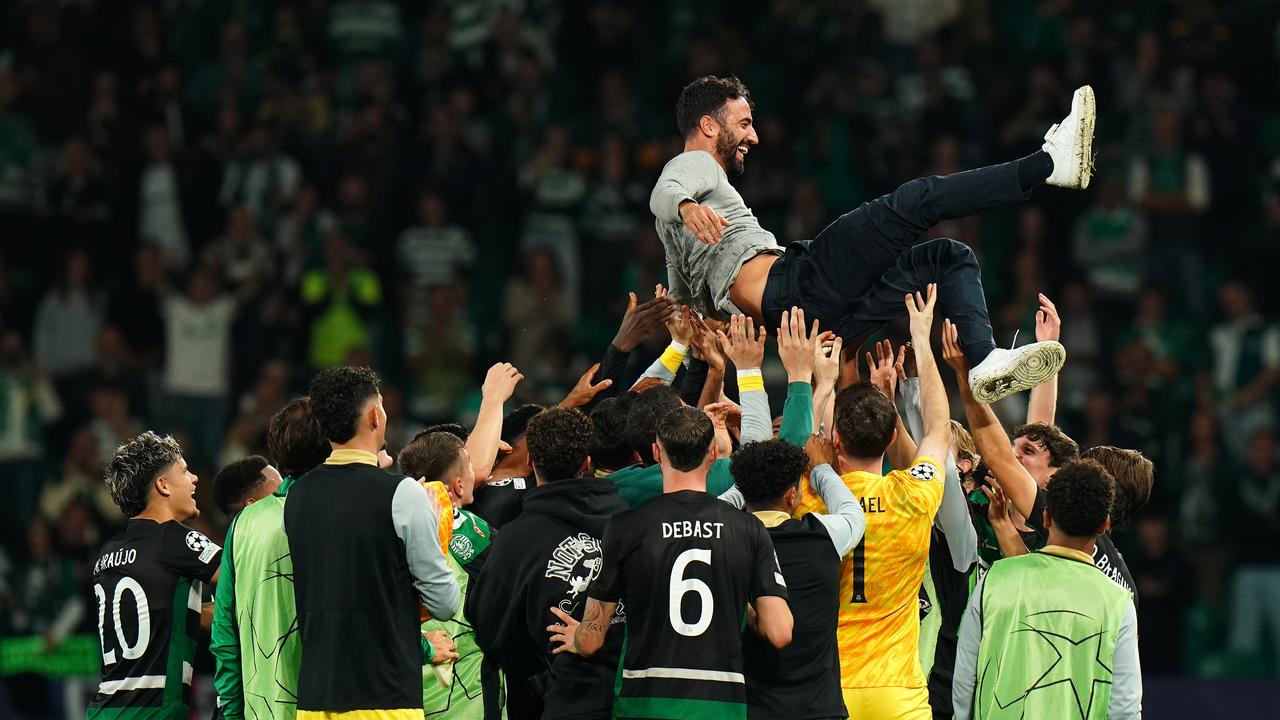 LISBON, PORTUGAL - NOVEMBER 05: Ruben Amorim, Head Coach of Sporting CP, is thrown into the air by his players to celebrate his last home match as manager at the end of the UEFA Champions League 2024/25 League Phase MD4 match between Sporting Clube de Portugal and Manchester City at Estadio Jose Alvalade on November 05, 2024 in Lisbon, Portugal. (Photo by Gualter Fatia/Getty Images)