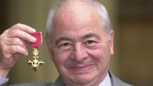 British author Colin Dexter, pictured in 2000 after receiving an Order of the British Empire, has died aged 86. Picture: John Stillwell/PA, File via AP