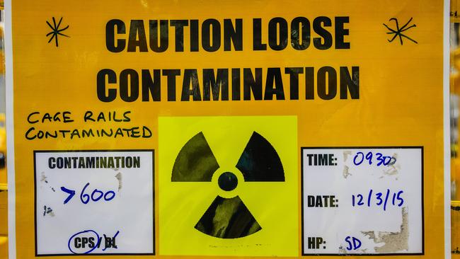 A sign warns staff of radiation levels at the Opal Nuclear Reactor.