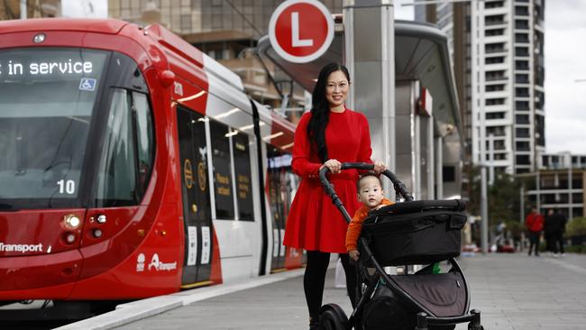 Sydney Olympic Park resident Ivy Chung, with her baby boy Kye, said the new light rail would make getting to the Parramatta CBD easier. Picture: Richard Dobson