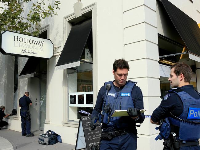 Police investigate the attempted armed robbery. Picture: Mark Stewart