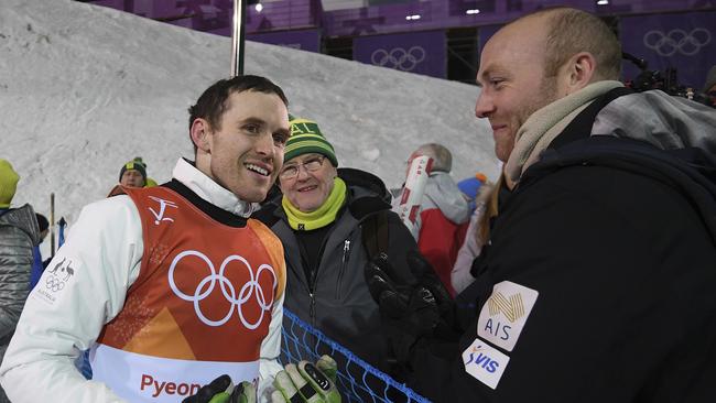 David Morris with his father Shane and brother Peter after being knocked out of the Men's Freestyle Aerials Final. Picture: AAP.