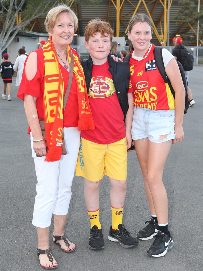 The Gold Coast Suns will host its first AFLW final when they take on the Sydney Swans on Saturday night. Lenore Goldfinch, Rory Milham and Ava Milham. 11 November 2023 Carrara Picture by Richard Gosling