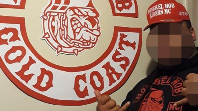 A Mongrel Mob member shows their hand sign