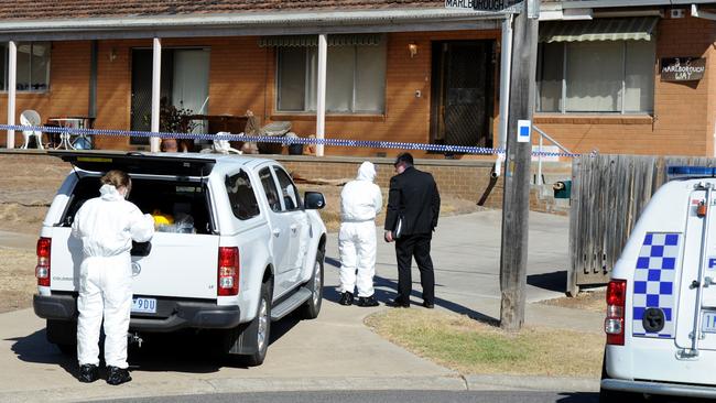 Forensic crews on the scene. Picture: Andrew Henshaw