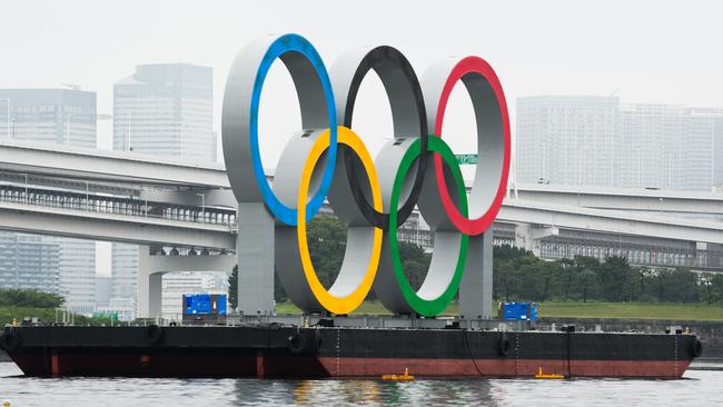 The Olympic rings float in Tokyo Bay as the opening ceremony next Friday edges closer. Picture: Akio Kon