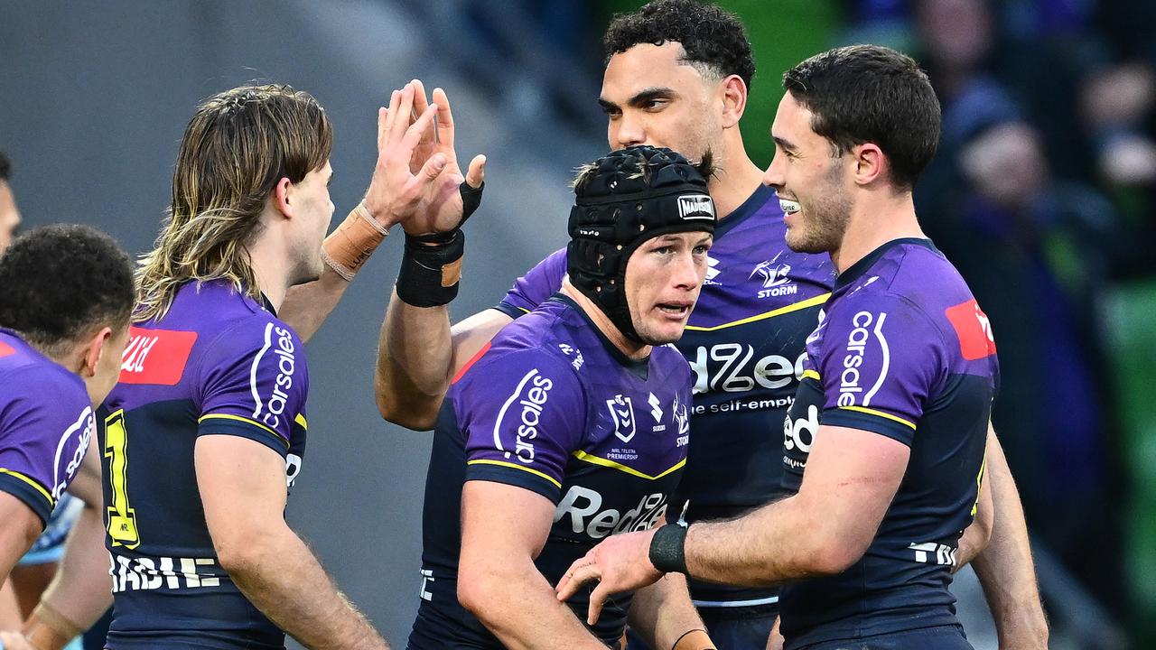 MELBOURNE, AUSTRALIA - SEPTEMBER 14: Harry Grant of the Storm celebrates with team mates after scoring a try during the NRL Qualifying Final match between Melbourne Storm and Cronulla Sharks at AAMI Park on September 14, 2024 in Melbourne, Australia. (Photo by Quinn Rooney/Getty Images)