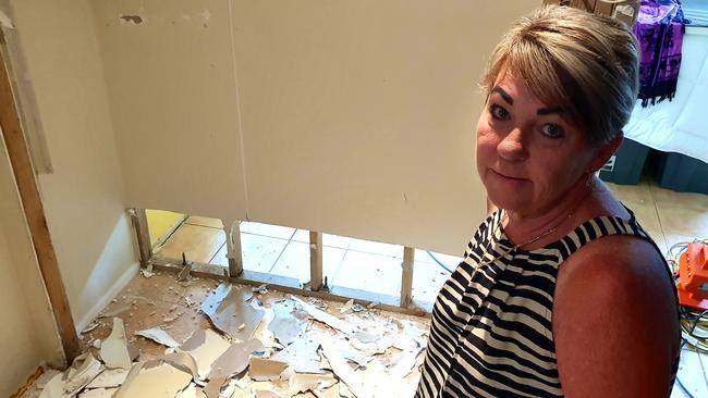 Therese Rowe inside the bottom level of her home at Poinsettia Ave, Hollywell. It's being torn apart after sewage flowed into the property. Picture: Luke Mortimer