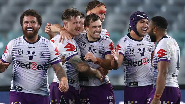 SYDNEY, AUSTRALIA - SEPTEMBER 04: Cameron Munster of the Storm celebrates after scoring a try during the round 17 NRL match between the South Sydney Rabbitohs and the Melbourne Storm at ANZ Stadium on September 04, 2020 in Sydney, Australia. (Photo by Cameron Spencer/Getty Images)