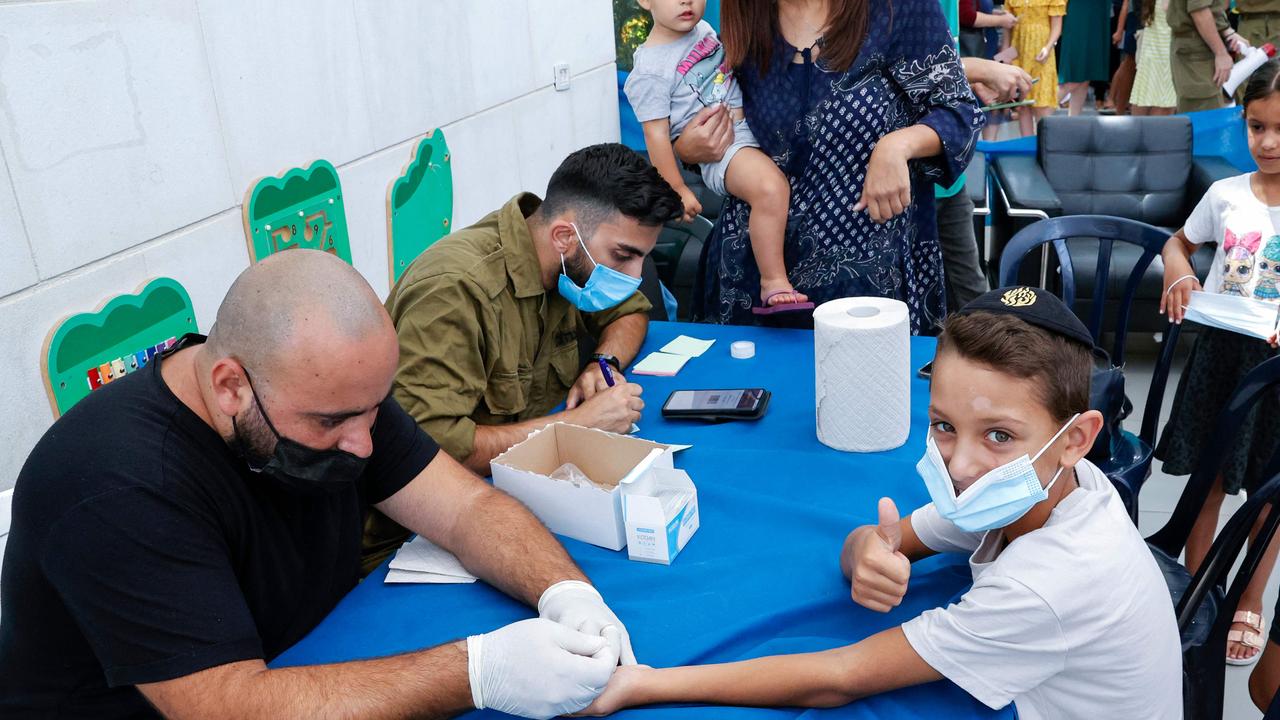 Israeli boy gives the thumbs up as he is given an antibody test in Tel Aviv on Sunday: Picture: Jack Guez/AFP