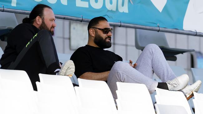 Hamdi Alameddine (left) is a regular target of NSW Police, but looked relaxed as he watched on in the grandstand.