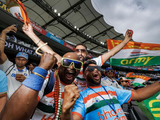 Indian fans celebrate the wicket of Marnus Labuschagne on the second day of the test between India and Australia at The Gabba. Picture Lachie Millard