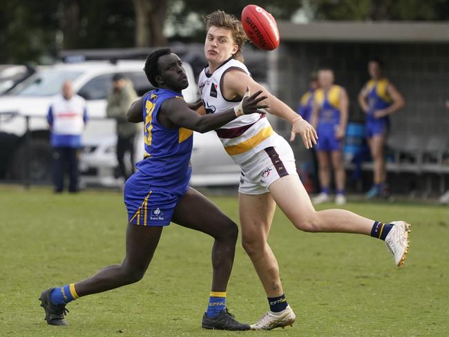 EFNL: Noble Park’s Riet Pal battles Lucas Bridger of Doncaster East. Picture: Valeriu Campan