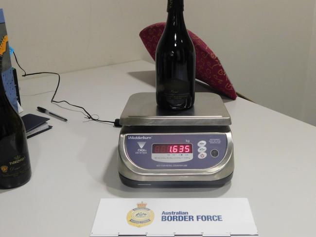 Australian Border Force officers said two 750ml wine bottles returned positive results for cocaine. Picture: ABF