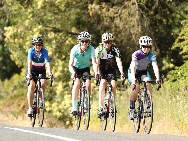 The Barker mag - pics of female cyclists in the Adelaide Hills. Pictured are Suzie Gray(yellow helmet and green on shirt), Sarah Rawlinson(seafoam green vest and white helmet), Victoria Veitch (Silver, purple, and blue top), and Ethne Baker (Italian top and grey helmet).