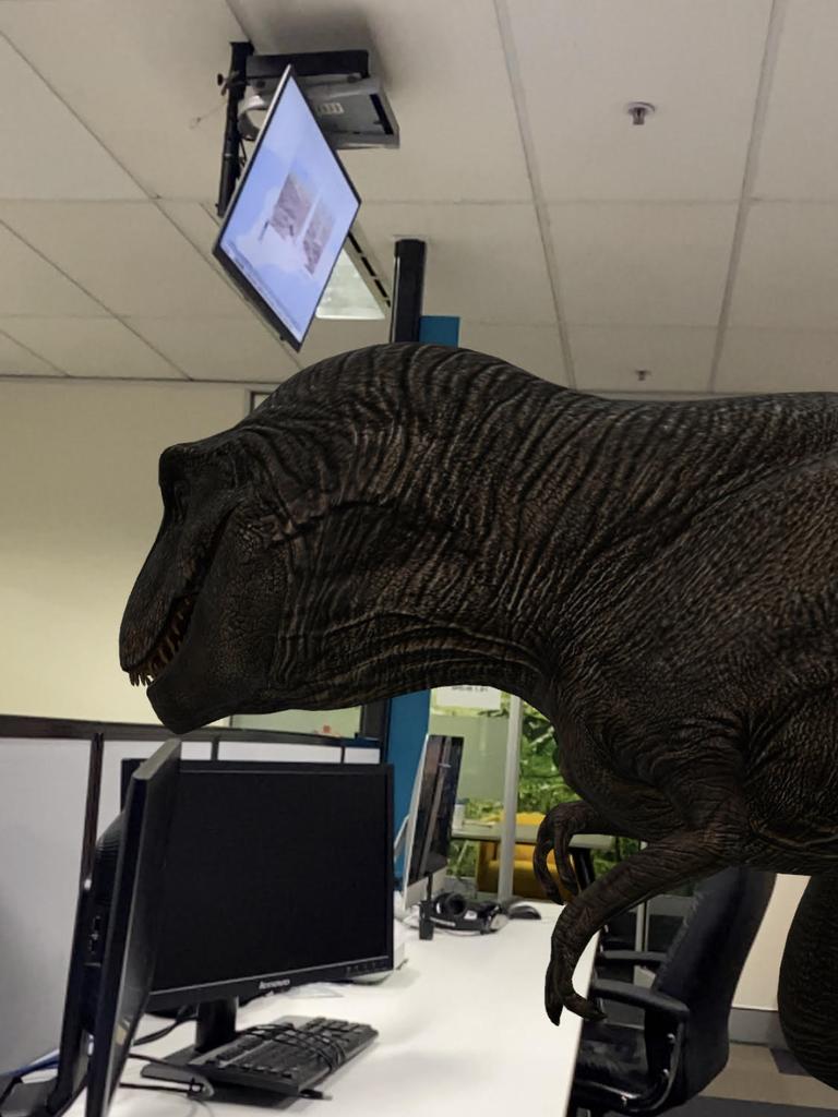 An example of one of the AR dinosaurs working hard at their digital media job.