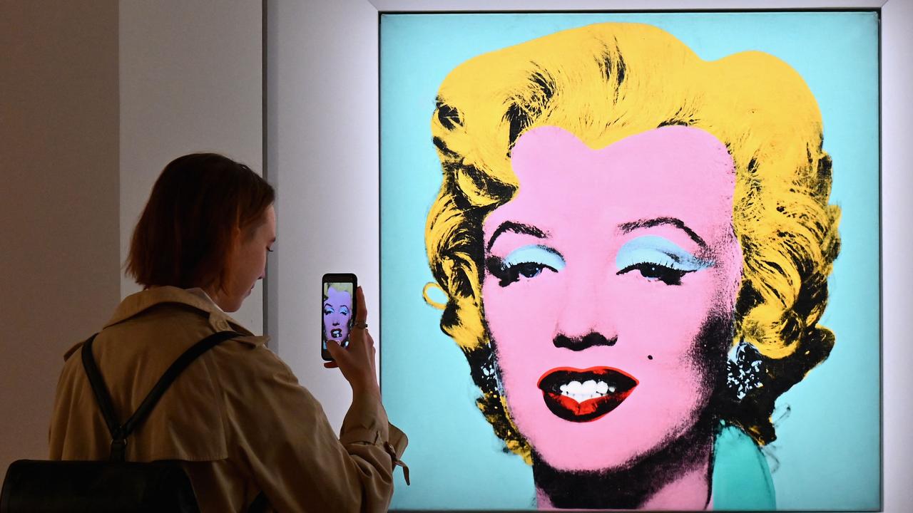 An iconic portrait of Marilyn Monroe by American pop art visionary Andy Warhol went under the hammer for a record $195 million US at Christie's on Monday, becoming the most expensive 20th century artwork ever sold at public auction. Picture: Angela Weiss/AFP