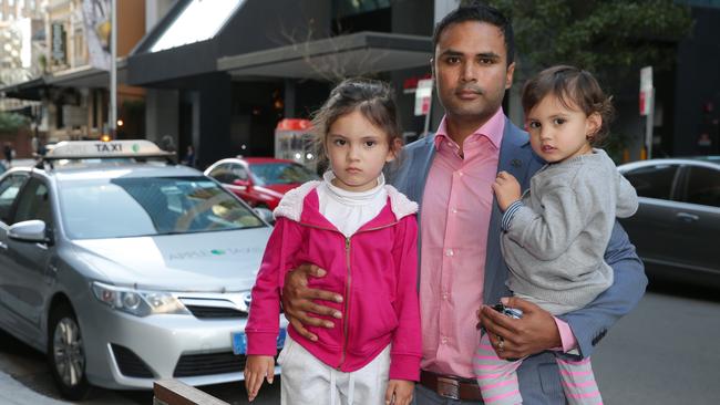 Debs Majumdar with his children Evelyn, 4, and Anjali, 2, on Berry St. Picture: Adam Ward