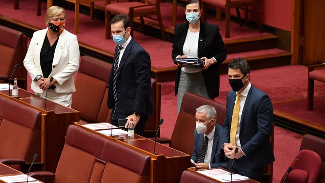 Nationals Senators Matt Canavan, Sam McMahon and Liberal Senators Concetta Fierravanti-Wells, Gerard Rennick and Alex Antic vote for One Nation leader Senator Pauline Hanson’s vaccine discrimination bill on Monday. Picture: AAP / Mick Tsikas