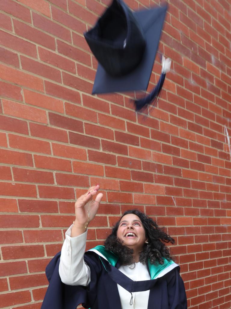 Graduate Afreen Ahmed celebrates in classic fashion. Picture: Mark Wilson